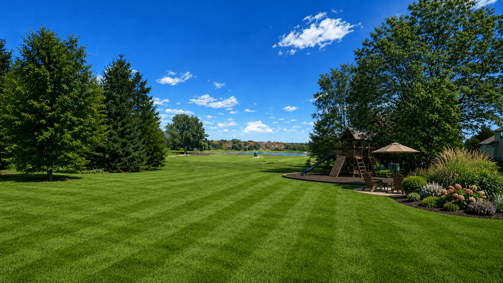 Outdoor living concept showing open lawn, play area, and landscape lighting